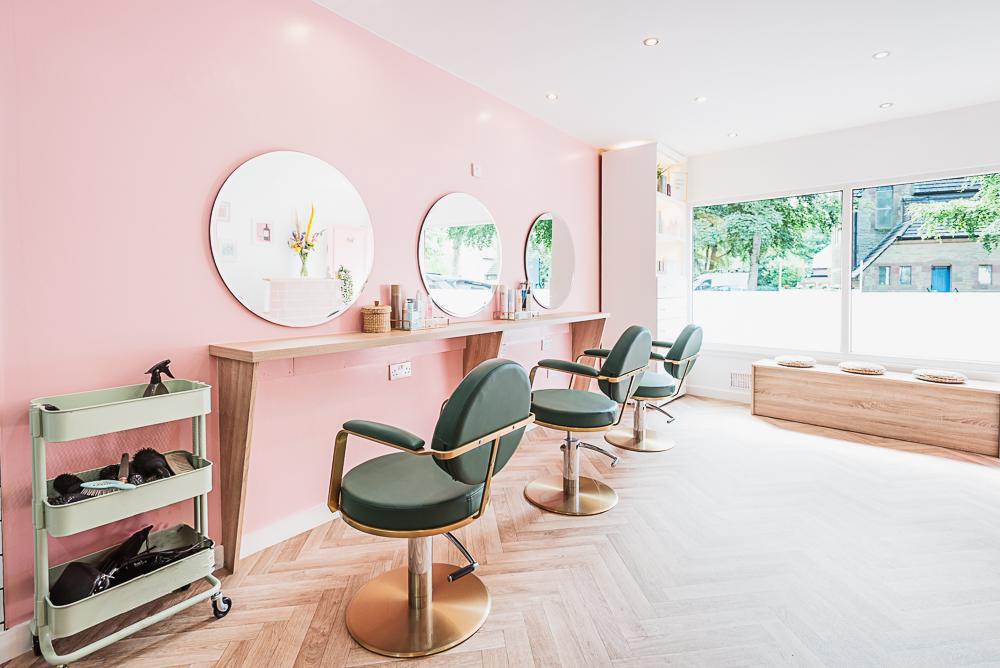 An interior picture of the salon showing the boutique seating and floor layout